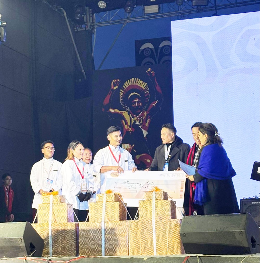 Winner of Naga Chef Season 11, Merennungsang Lemtur receiving his award during the ongoing Hornbill Festival 2024 at Kisama Heritage Village on December 9.